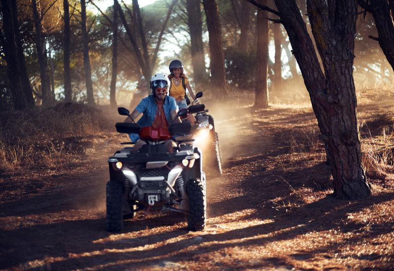 Two people enjoy an off-roading adventure on an ATV in the Phoenix Area